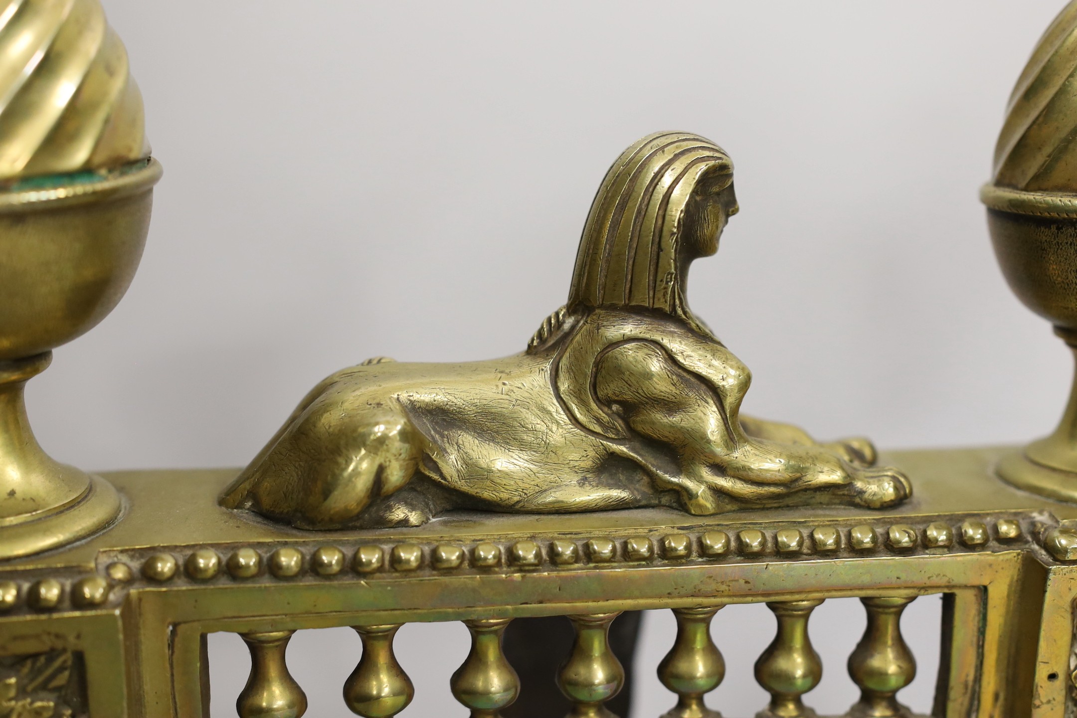 A pair of Egyptian revival bronze chenet, 27cm high